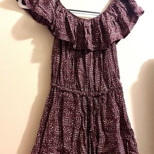 Eggplant-colored, patterned and ruffled romper